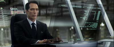 Elysium - John Carlyle Uploads a Computer Program for Safekeeping to His Brain